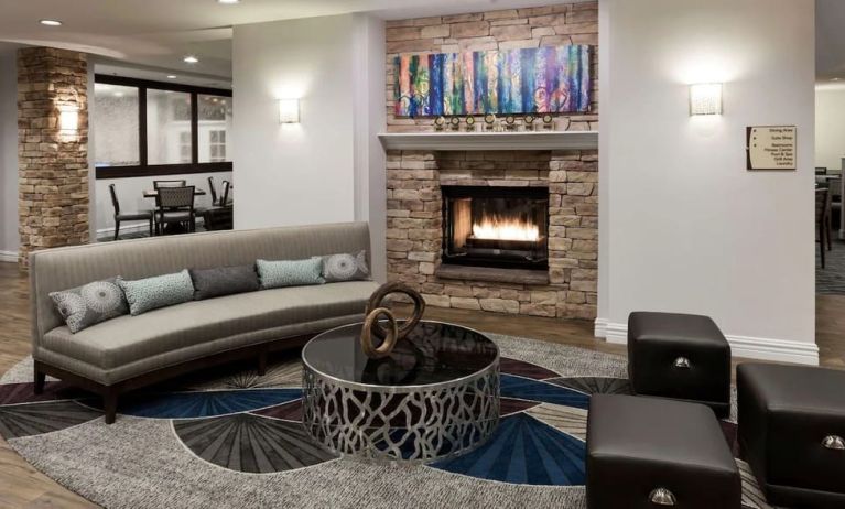 Lobby lounge with fireplace at Homewood Suites By Hilton San Jose Airport-Silicon Valley.