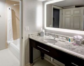 Private guest bathroom with combined tub and shower atHomewood Suites By Hilton San Jose Airport-Silicon Valley.