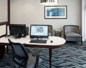 Business center with computers, printer and ergonomic chairs atHomewood Suites By Hilton San Jose Airport-Silicon Valley.