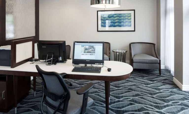 Business center with computers, printer and ergonomic chairs atHomewood Suites By Hilton San Jose Airport-Silicon Valley.