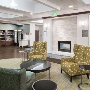 Lobby lounge with fireplace at Homewood Suites By Hilton Fresno Airport/Clovis.