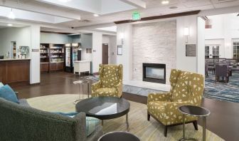 Lobby lounge with fireplace at Homewood Suites By Hilton Fresno Airport/Clovis.
