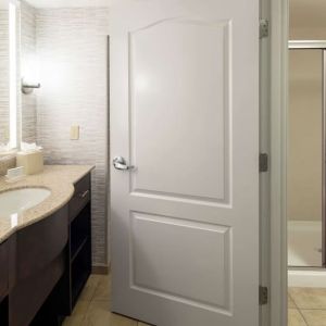 Private guest bathroom with shower and free toiletries at Homewood Suites By Hilton Fresno Airport/Clovis.