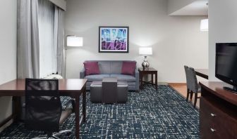 Day use room's workspace and lounge area at Homewood Suites By Hilton Fresno Airport/Clovis.