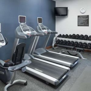 Well equipped fitness center at Homewood Suites By Hilton Fresno Airport/Clovis.