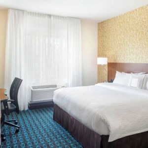 King room with work desk and TV at Fairfield Inn & Suites By Marriott North Bergen.