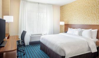 King room with work desk and TV at Fairfield Inn & Suites By Marriott North Bergen.