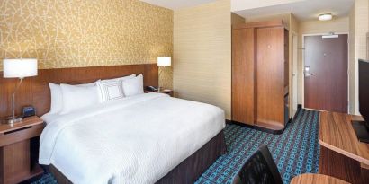 King room with work desk and TV at Fairfield Inn & Suites By Marriott North Bergen.