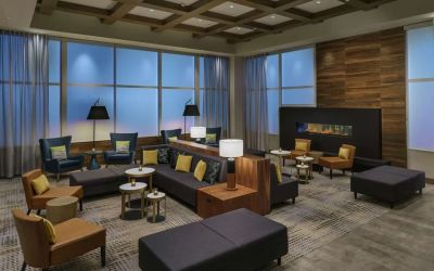 Lobby lounge with fireplace and workspace at Hilton Garden Inn Sunnyvale.