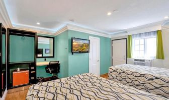Queen room with mini-fridge at Mid City Inn - Los Angeles.