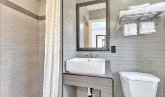 Private bathroom with shower at Mid City Inn - Los Angeles.