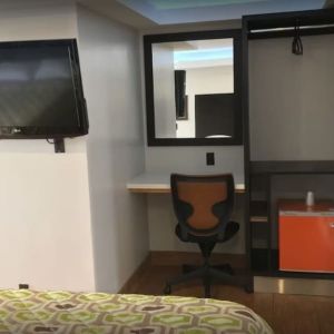 Work desk and TV at Mid City Inn - Los Angeles.