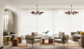 Lobby lounge and workspace at Kimpton Theta New York - Times Square.