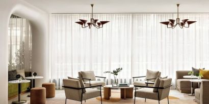 Lobby lounge and workspace at Kimpton Theta New York - Times Square.