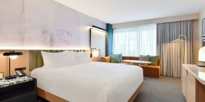 Day use room with king bed at Kimpton Theta New York - Times Square.