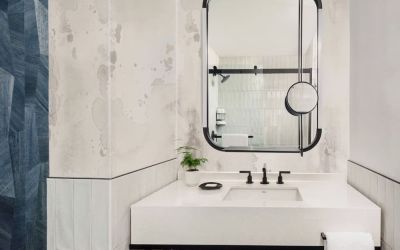 Private guest bathroom with shower and free toiletries at Kimpton Theta New York - Times Square.