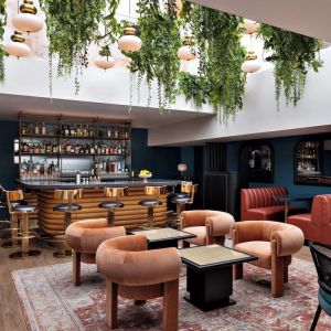 On-site bar with lounge seating at Kimpton Theta New York - Times Square.