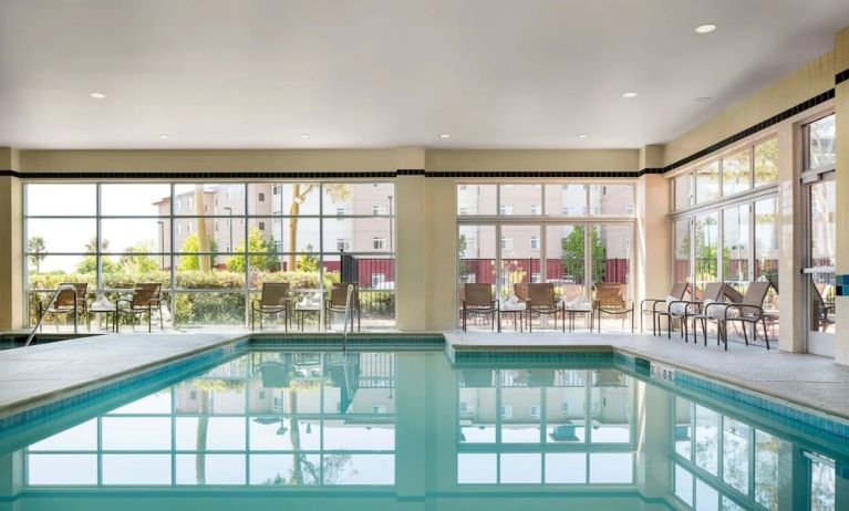 Indoor pool with lounge chairs at DoubleTree By Hilton San Francisco Airport North Bayfront.