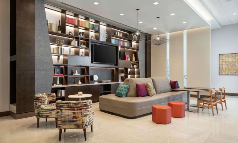 Lobby lounge area and workspace at 	Home2 Suites By Hilton Denver Downtown Convention Center.