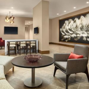 Lounge area and coworking space at Crowne Plaza Dallas Market Ctr - Love Field.