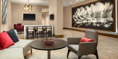 Lounge area and coworking space at Crowne Plaza Dallas Market Ctr - Love Field.