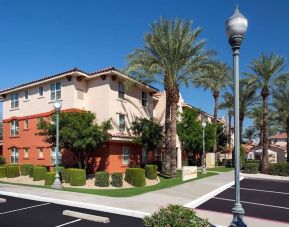 Exterior view and parking area at Sonesta Simply Suites Phoenix Scottsdale.