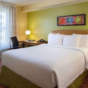 Day use room with king bed and work desk at Sonesta Simply Suites Phoenix Scottsdale.
