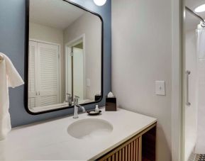 Private guest bathroom with shower and free toiletries at Sonesta Select Scottsdale At Mayo Clinic Campus.