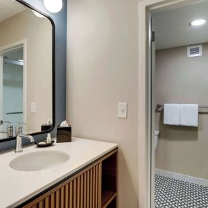 Private guest bathroom with shower and free toiletries at Sonesta Select Scottsdale At Mayo Clinic Campus.