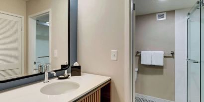 Private guest bathroom with shower and free toiletries at Sonesta Select Scottsdale At Mayo Clinic Campus.