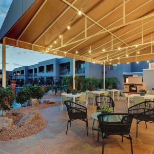 Hotel patio with comfortable seating and fireplace at Sonesta Select Scottsdale At Mayo Clinic Campus.
