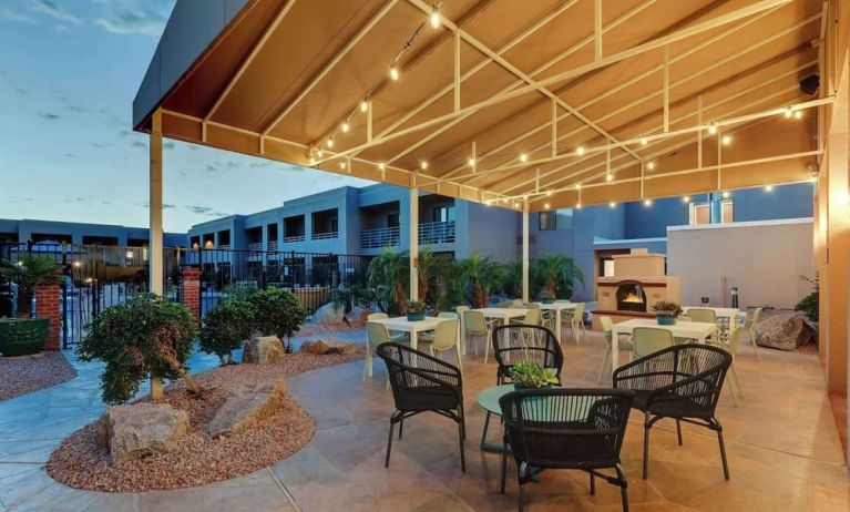 Hotel patio with comfortable seating and fireplace at Sonesta Select Scottsdale At Mayo Clinic Campus.