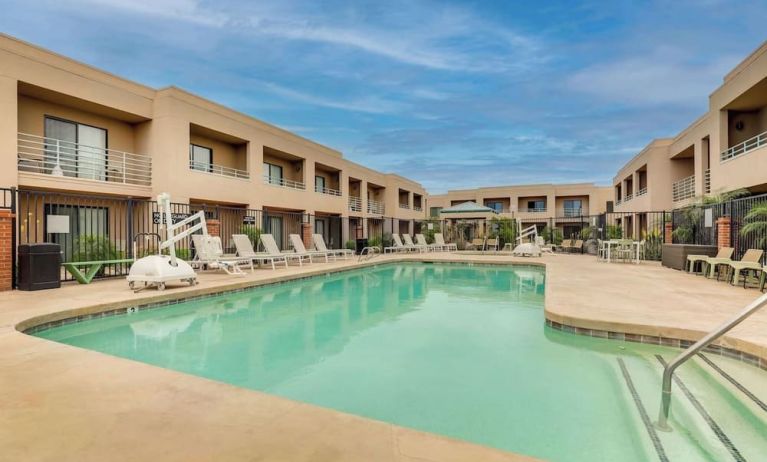 Outdoor pool with lounge chairs at Sonesta Select Scottsdale At Mayo Clinic Campus.