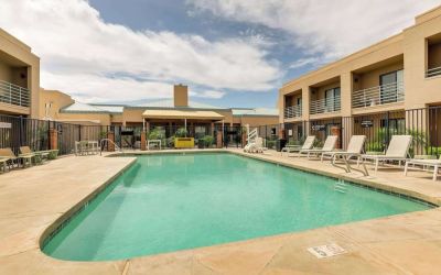 Relaxing outdoor pool with lounge chairs at Sonesta Select Scottsdale At Mayo Clinic Campus.