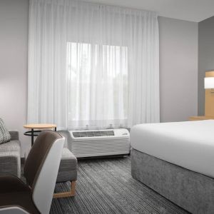Day use room with sofa and work desk at TownePlace Suites Franklin Cool Springs.