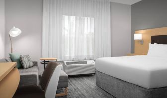 Day use room with sofa and work desk at TownePlace Suites Franklin Cool Springs.