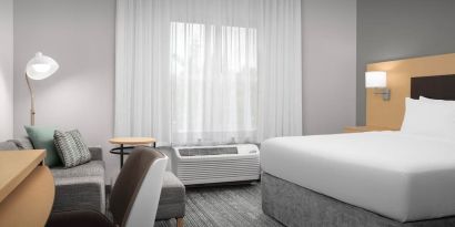 Day use room with sofa and work desk at TownePlace Suites Franklin Cool Springs.