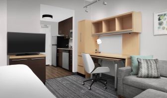 Day room amenities include TV, work desk, sofa, and in-room kitchen at TownePlace Suites Franklin Cool Springs.