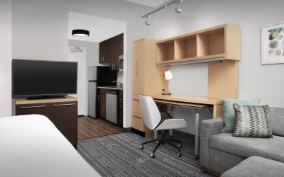 Day room amenities include TV, work desk, sofa, and in-room kitchen at TownePlace Suites Franklin Cool Springs.