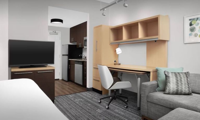 Day room amenities include TV, work desk, sofa, and in-room kitchen at TownePlace Suites Franklin Cool Springs.