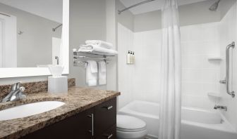 Guest bathroom with shower and tub at TownePlace Suites Franklin Cool Springs.