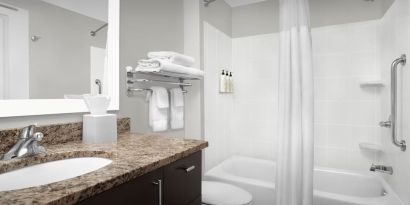 Guest bathroom with shower and tub at TownePlace Suites Franklin Cool Springs.