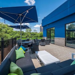 Terrace with ample seats perfect for coworking at Hampton Inn Detroit Southfield.
