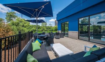 Terrace with ample seats perfect for coworking at Hampton Inn Detroit Southfield.
