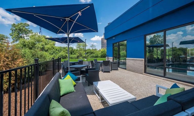 Terrace with ample seats perfect for coworking at Hampton Inn Detroit Southfield.
