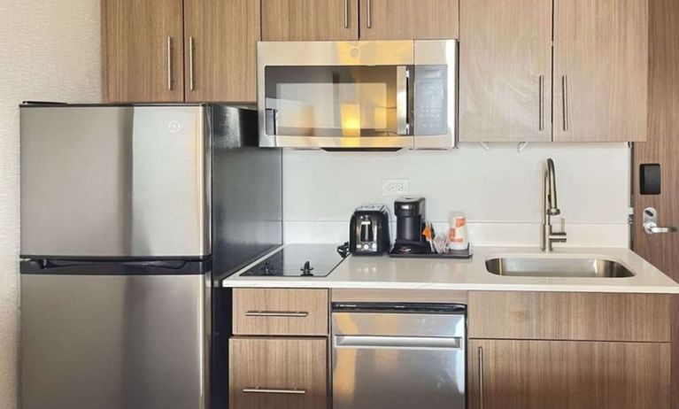 In-room kitchen available at MainStay Suites Oak Brook Terrace - Chicago.