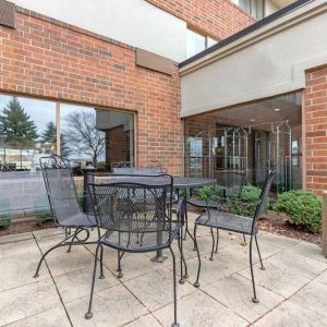 Outdoor terrace with seating at Holiday Inn Express Chicago - Downers Grove.