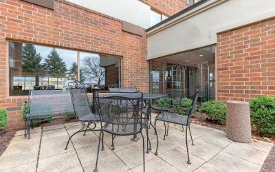 Outdoor terrace with seating at Holiday Inn Express Chicago - Downers Grove.
