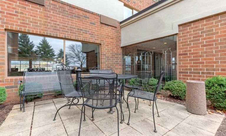 Outdoor terrace with seating at Holiday Inn Express Chicago - Downers Grove.