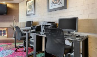 Business center with computers, printer and ergonomic chairs at Holiday Inn Express Chicago - Downers Grove.